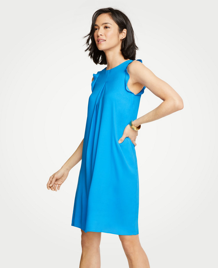 An inverted pleat front adds extra ease and fluidity to our breezy shoulder ruffle shift. Jewel neck. Sleeveless. Inverted pleat front. Back keyhole with hook-and-eye closure. Lined. 19 1/2 from natural waist.