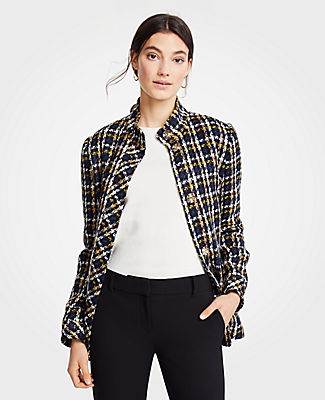 Coat check: cleanly structured and richly textured, our plaid jacket is tailor-made for the season. Stand collar. Long sleeves. Hidden snap front. Front flap welt pockets. Lined.