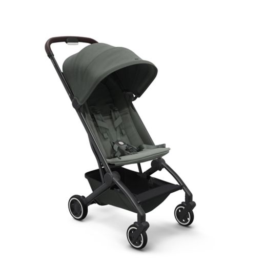 Charcoal gray stroller with an expansive canopy, designed to be compact for airplane overhead bin convenience on family trips.