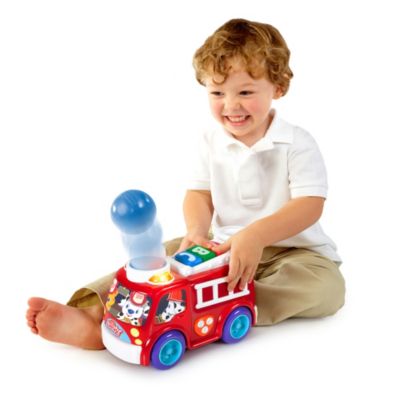 bright starts roll & pop train toy