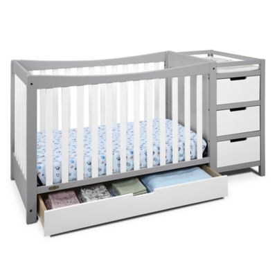 gray crib with changing table