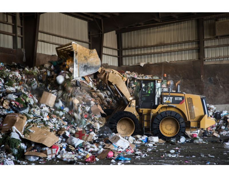 Load & Carry Bucket working in a transfer station.
