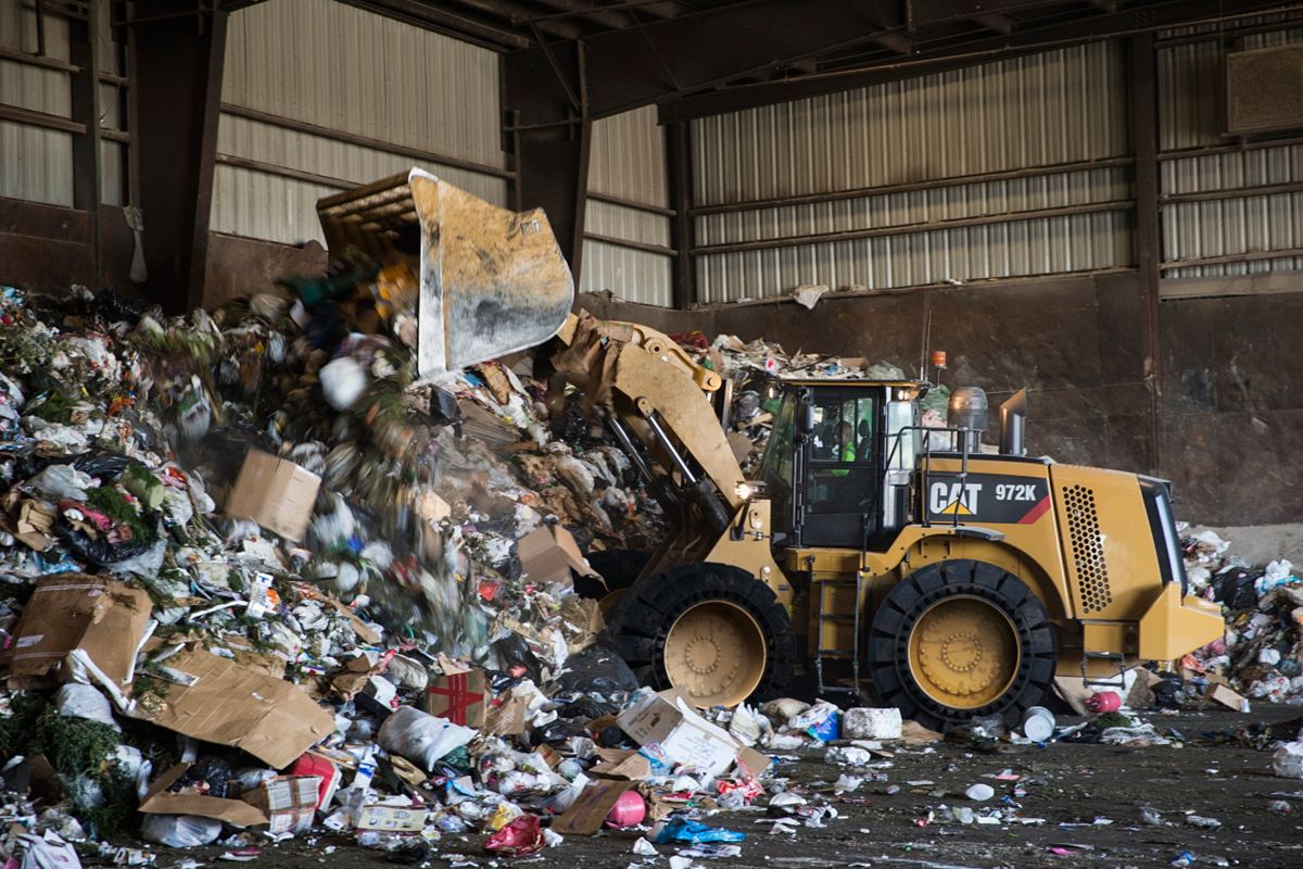 Load & Carry Bucket working in a transfer station.