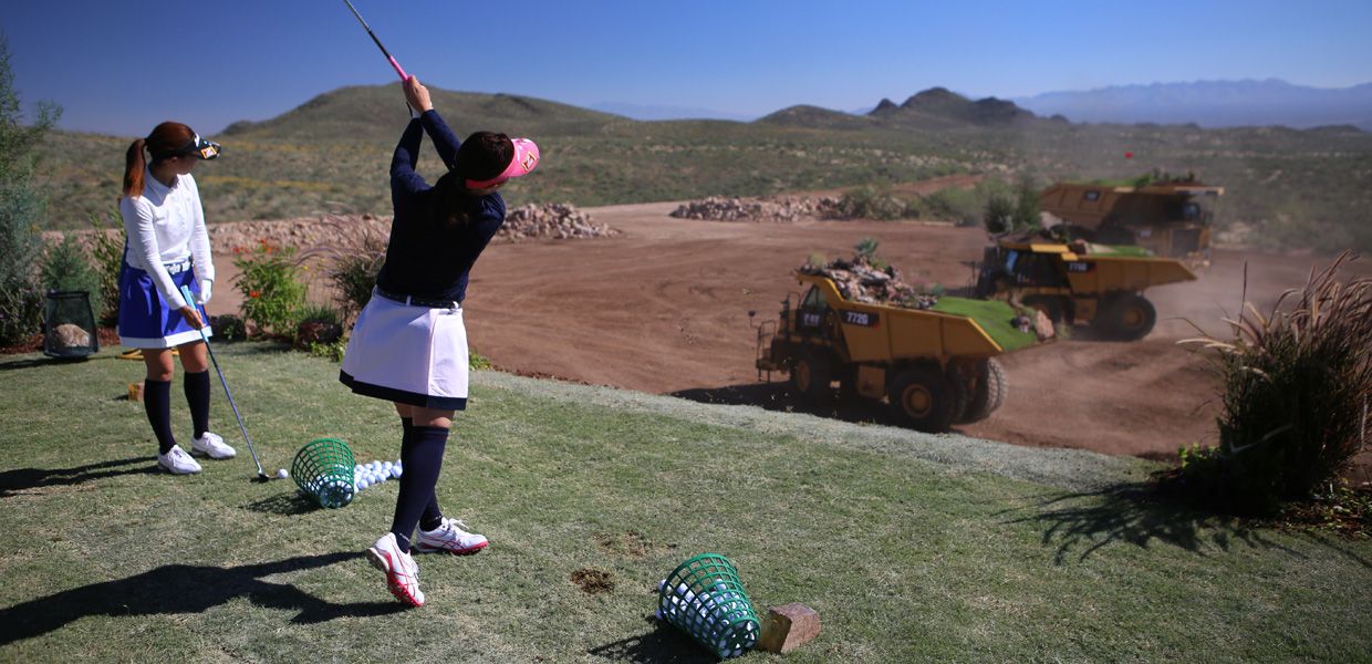 twin sisters Erimo and Marimo Ikeuchi—members of the Ladies Professional Golfers’ Association of Japan —take their best shots at this one-of-a-kind course