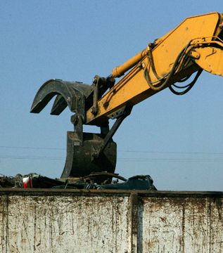 Contractors' Grapple unloading into a bin