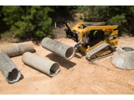 Cat® 289D Compact Track Loader and Material Handling Arm Moving Pipe