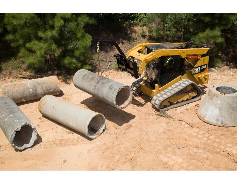 Cat® 289D Compact Track Loader and Material Handling Arm Moving Pipe