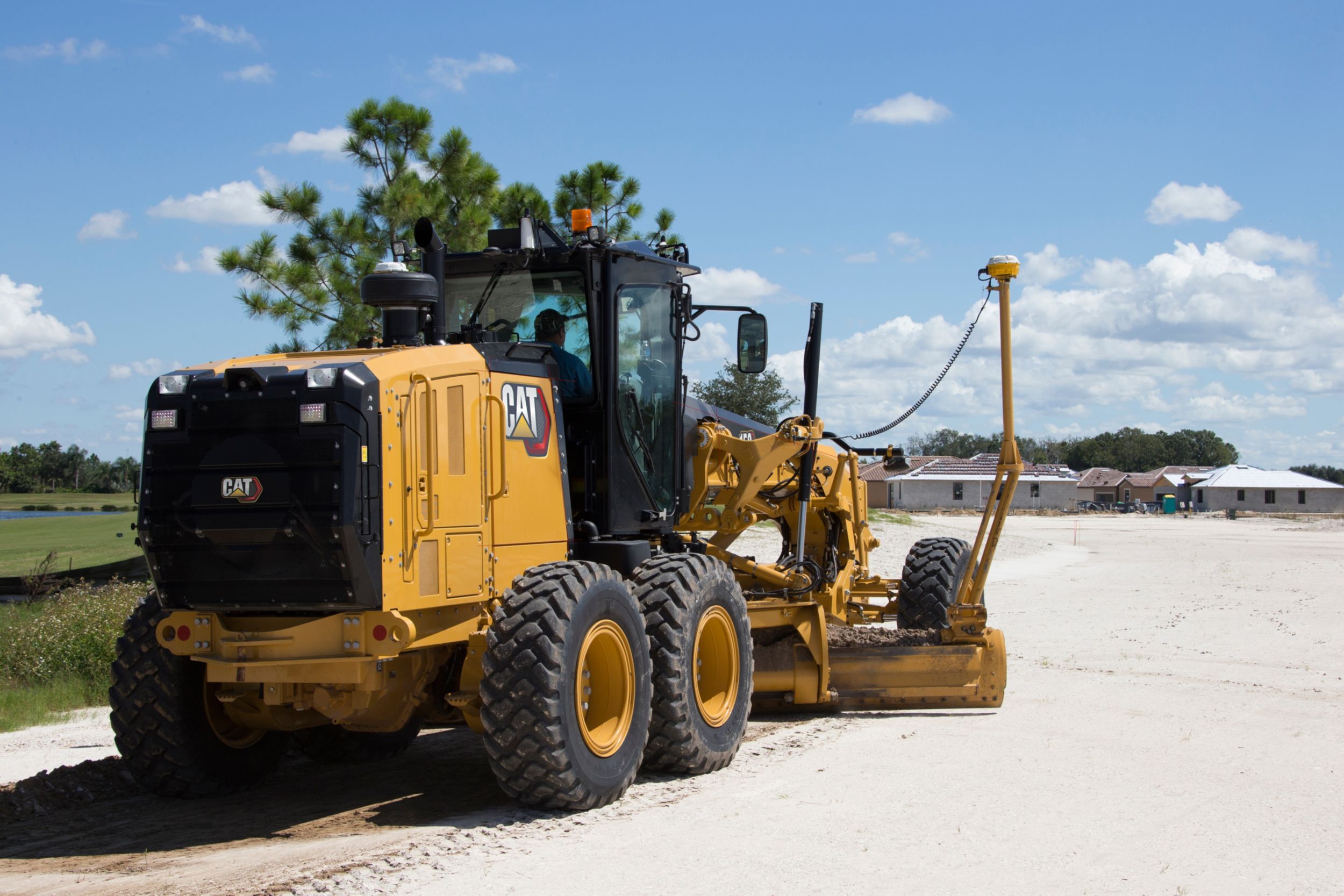 140 Motor Grader maintaing neighborhood roads