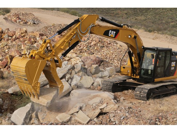 Site clean-up with Pin Grabber Coupler, Pro Plus thumb, and bucket.