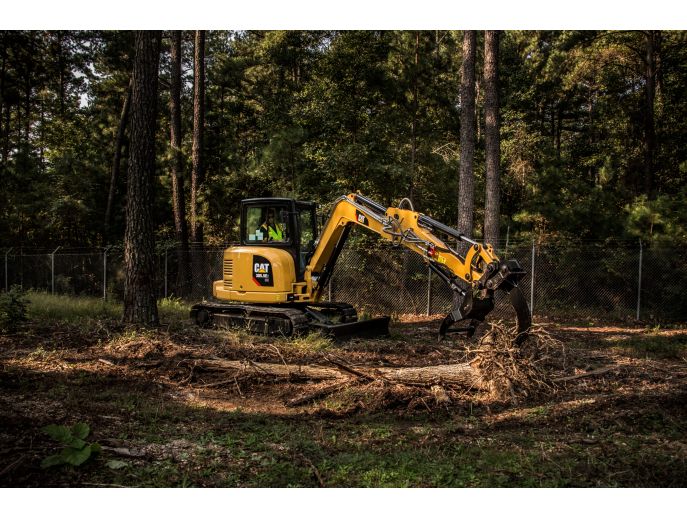 Cat® 305.5E2 Mini Excavator with Thumb and Ripper in Working Application