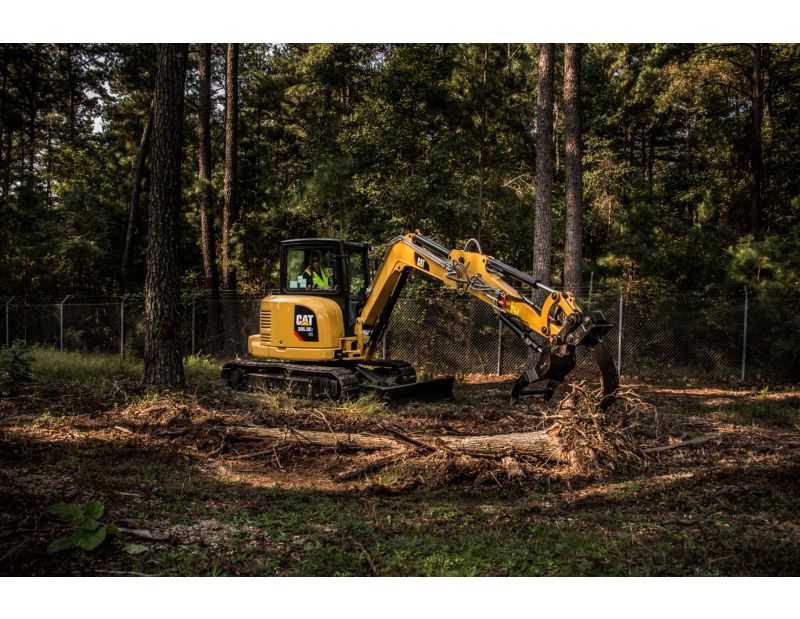 Cat® 305.5E2 Mini Excavator with Thumb and Ripper in Working Application
