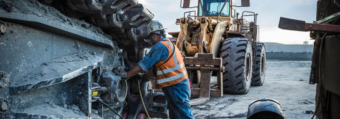 construction worker in the mud