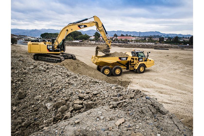 336F Excavator loading a 730C Articulated Truck with a General Duty Bucket