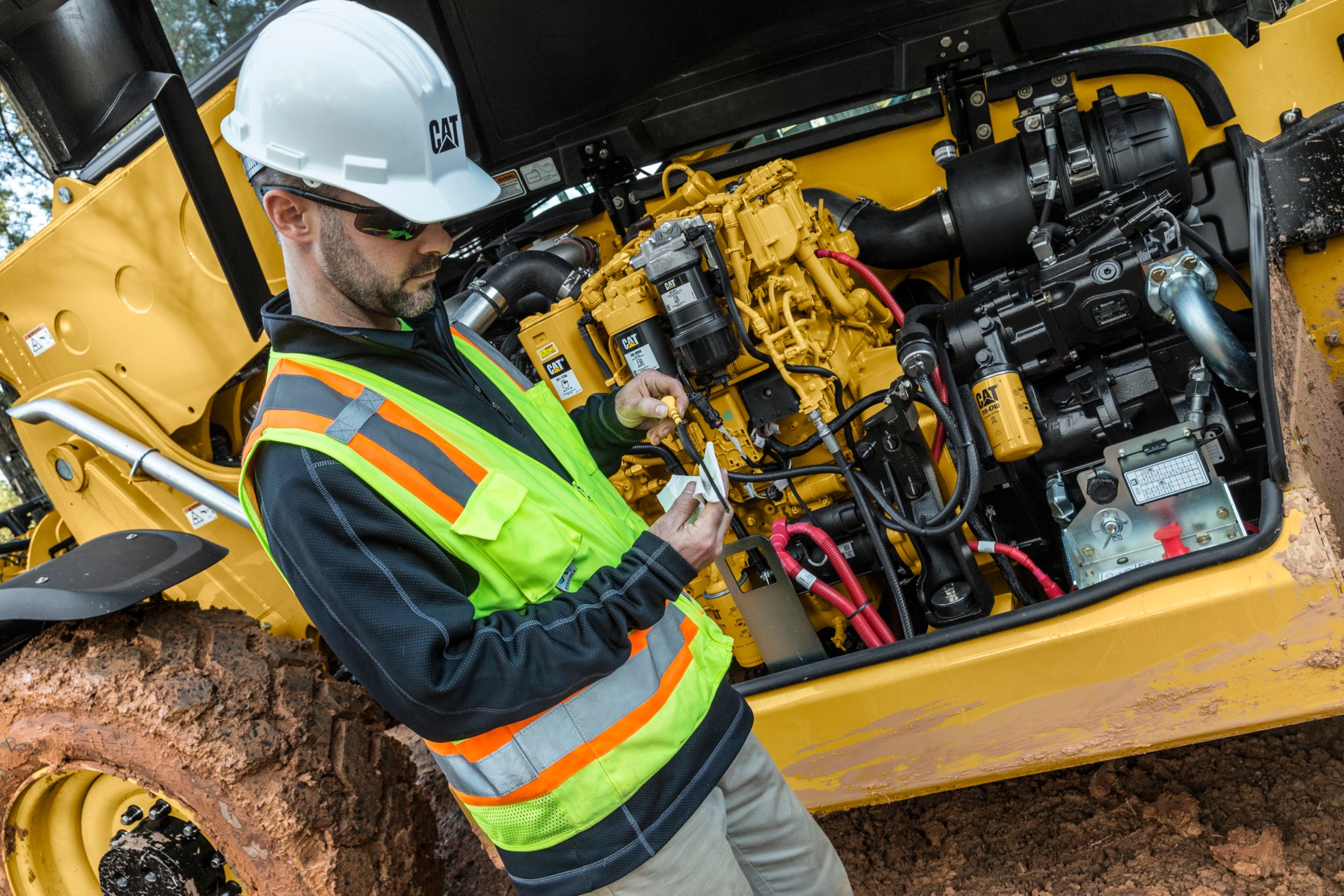 person performing maintenance on a Telehandler