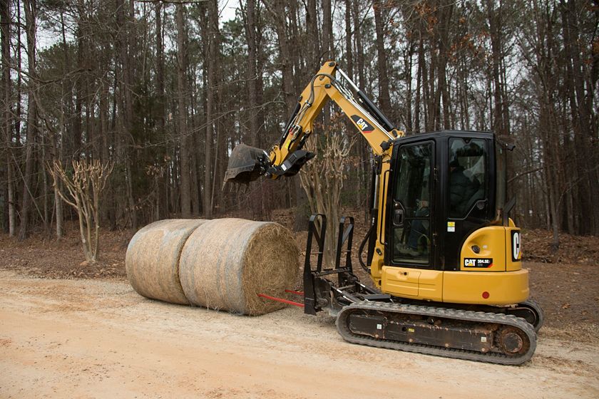 Cat® Bale Spear in use on a Cat 304.5E2