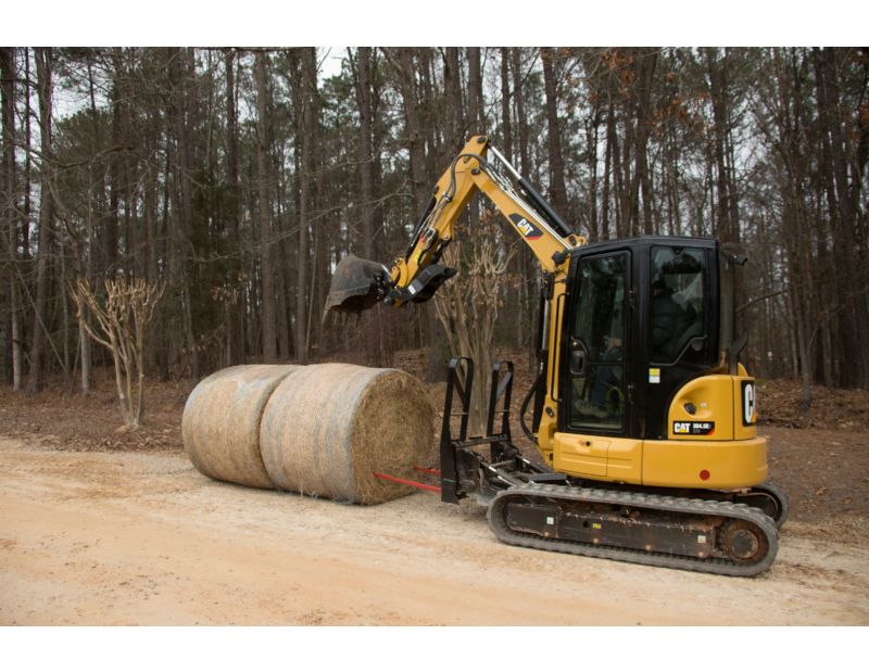 Cat® Bale Spear in use on a Cat 304.5E2
