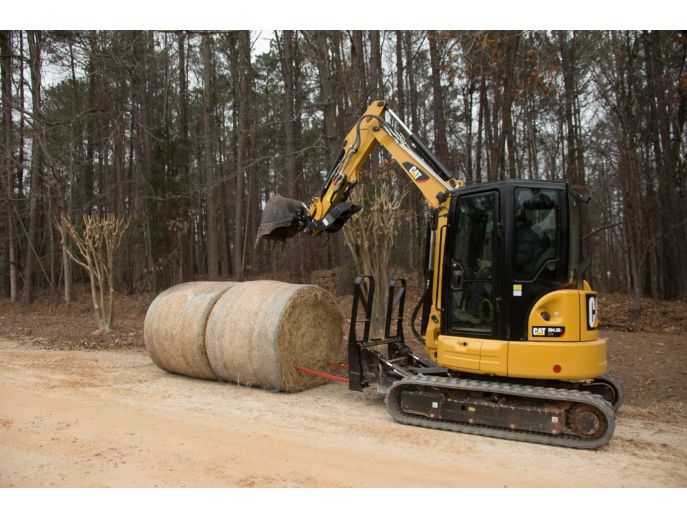 Cat® Bale Spear in use on a Cat 304.5E2