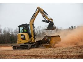 Cat® 304.5E2 XTC Mini Excavator sweeping with a BA118C Angle Broom