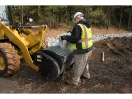 Customer Adding Mix to Cat® Mixing Bucket Using Integrated Bag Breakers