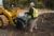 Customer Adding Mix to Cat® Mixing Bucket Using Integrated Bag Breakers