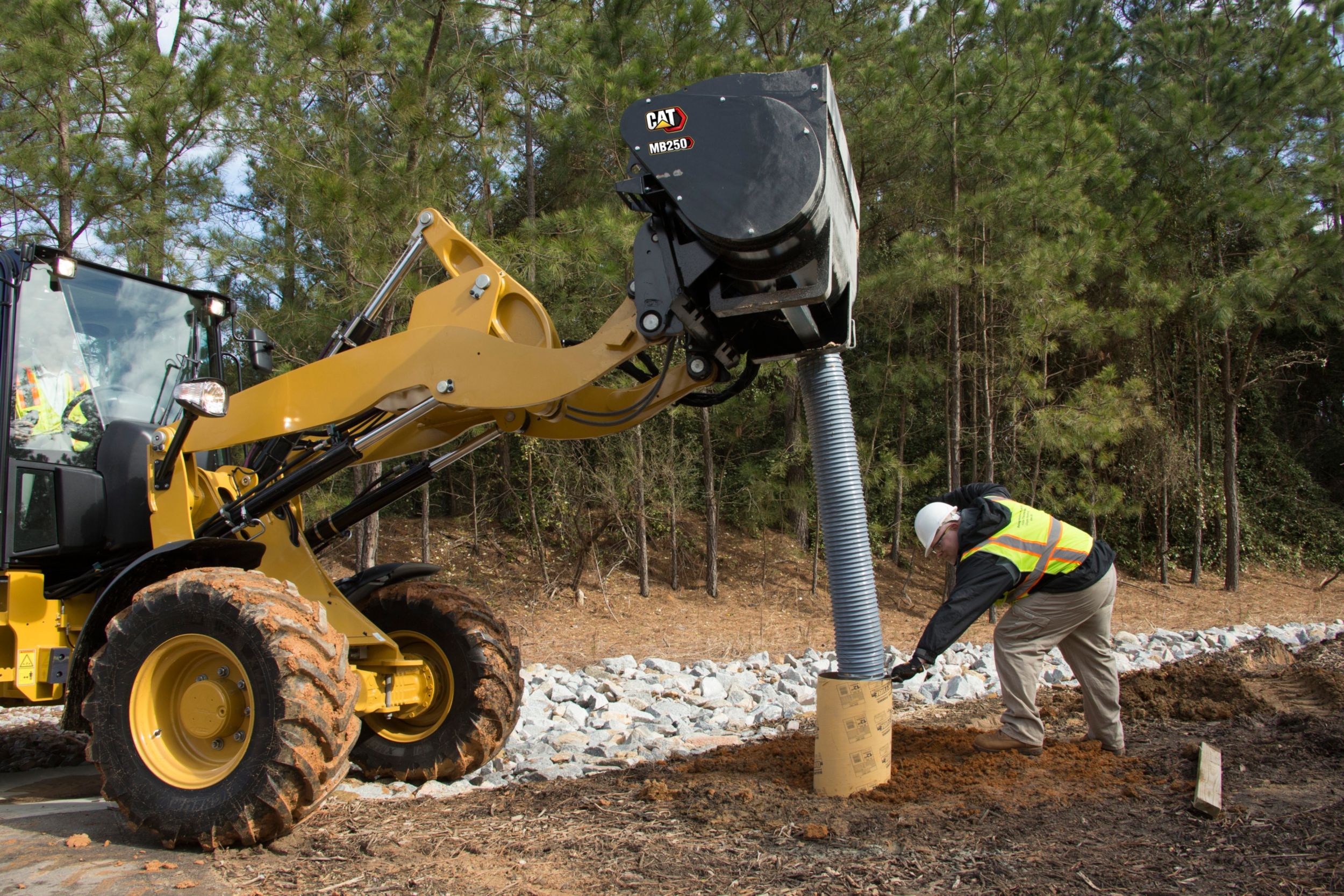 Customer using Cat® Mixing Bucket hose to direct mix right where you need it.