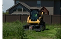 Cat® BR172 Brushcutter and 259D Compact Track Loader in a Landscaping Application