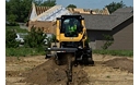 Cat® 259D Compact Track Loader and T9B Trencher Attachment Digging a Trench