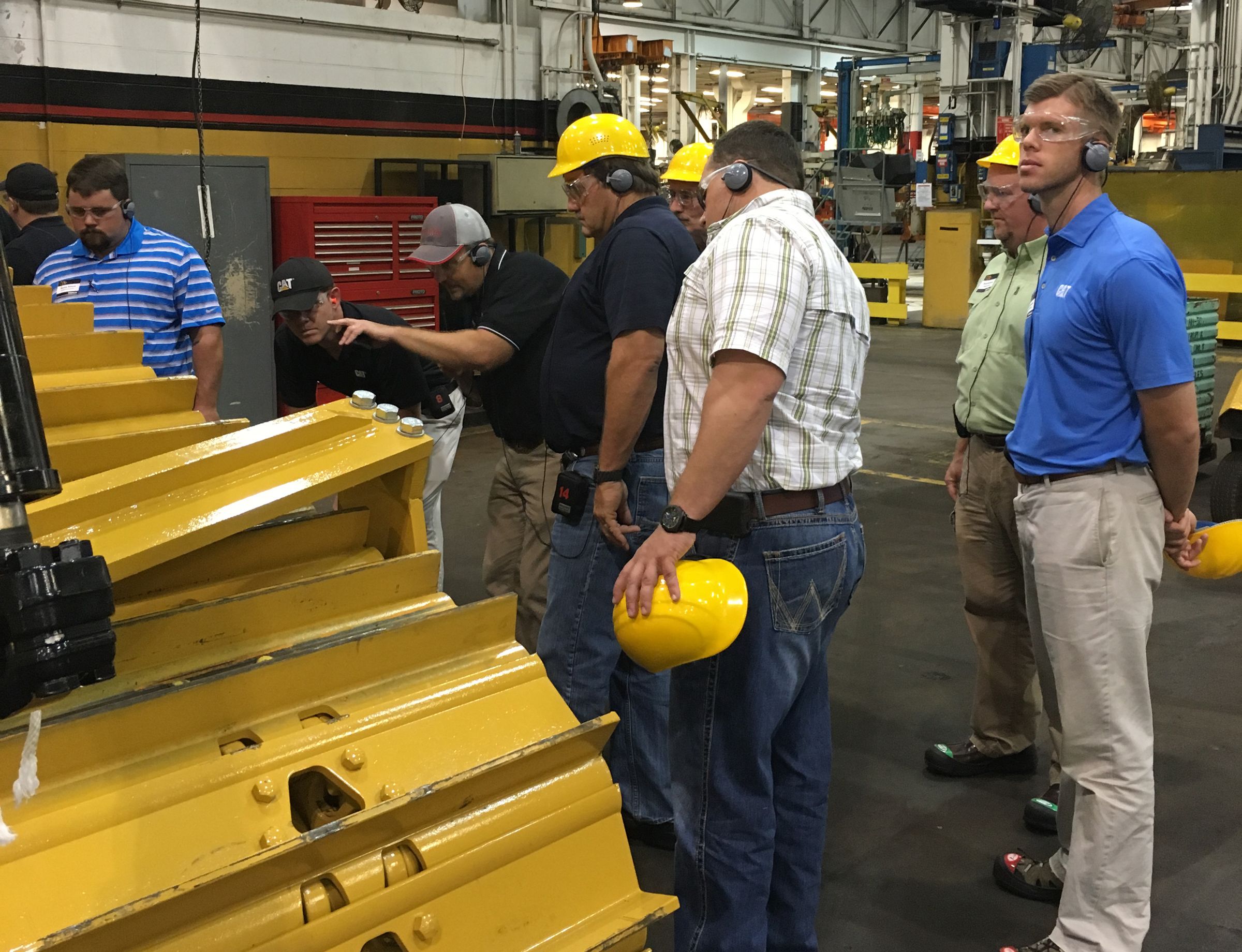 Santek Environmental employees tour the Caterpillar East Peoria dozer facility.