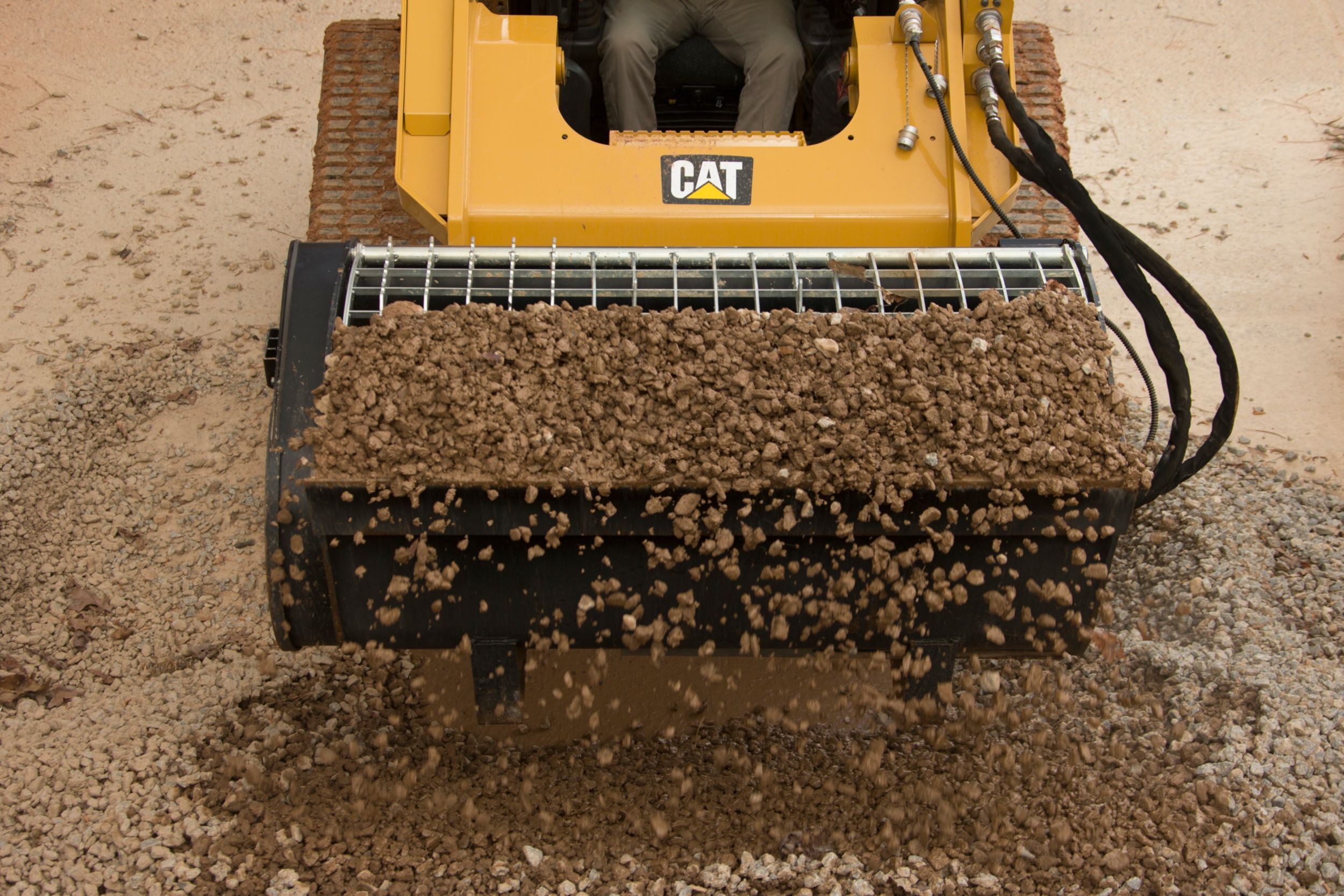 Cat® Mixing Bucket Scooping Rock>