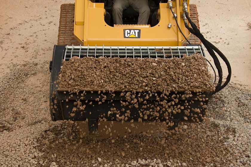 Cat® Mixing Bucket Scooping Rock