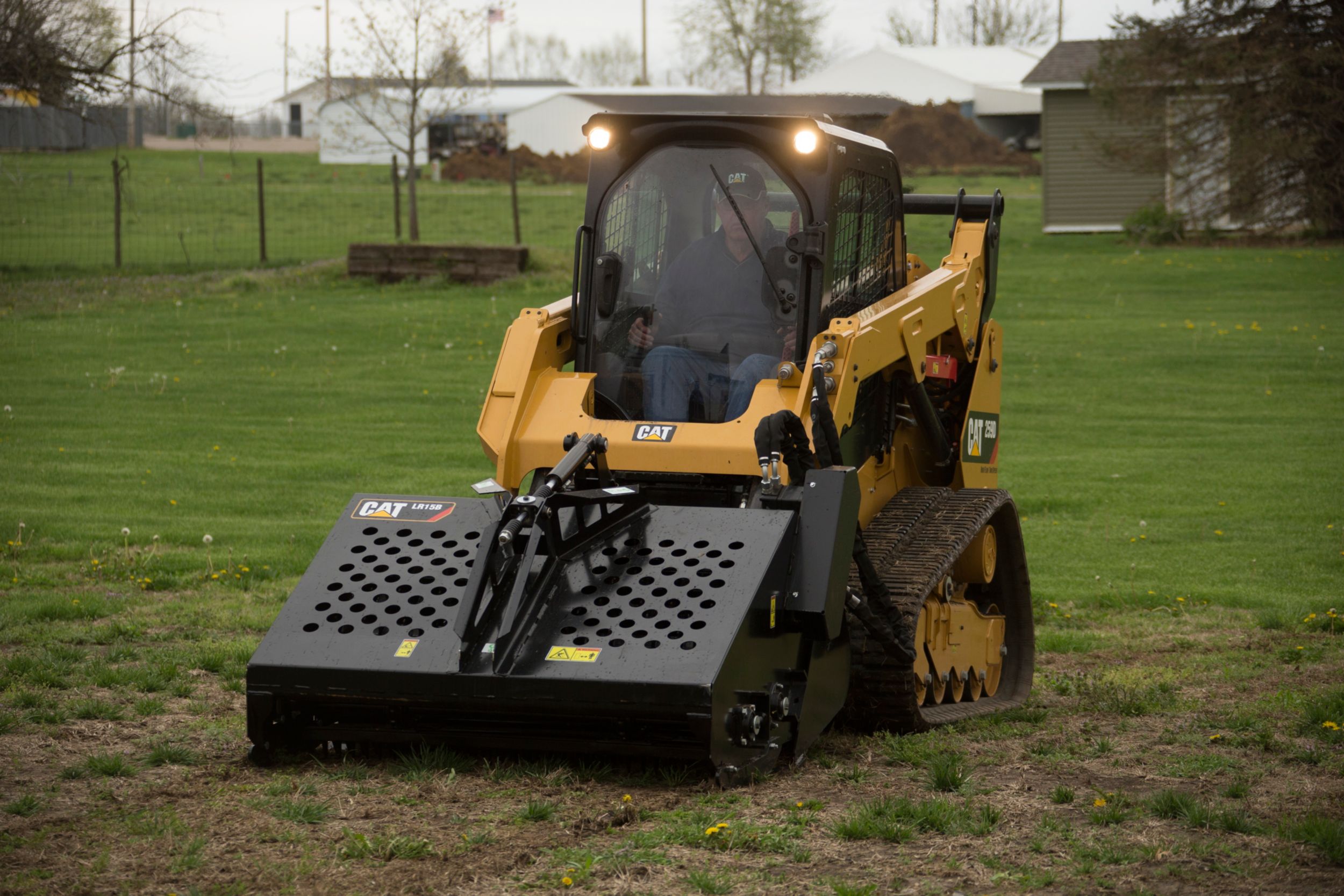 Cat® Landscape Rake on a 259D Compact Track Loader>