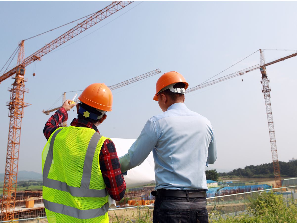 Cat dealer tech using computer to trouble shoot equipment issue