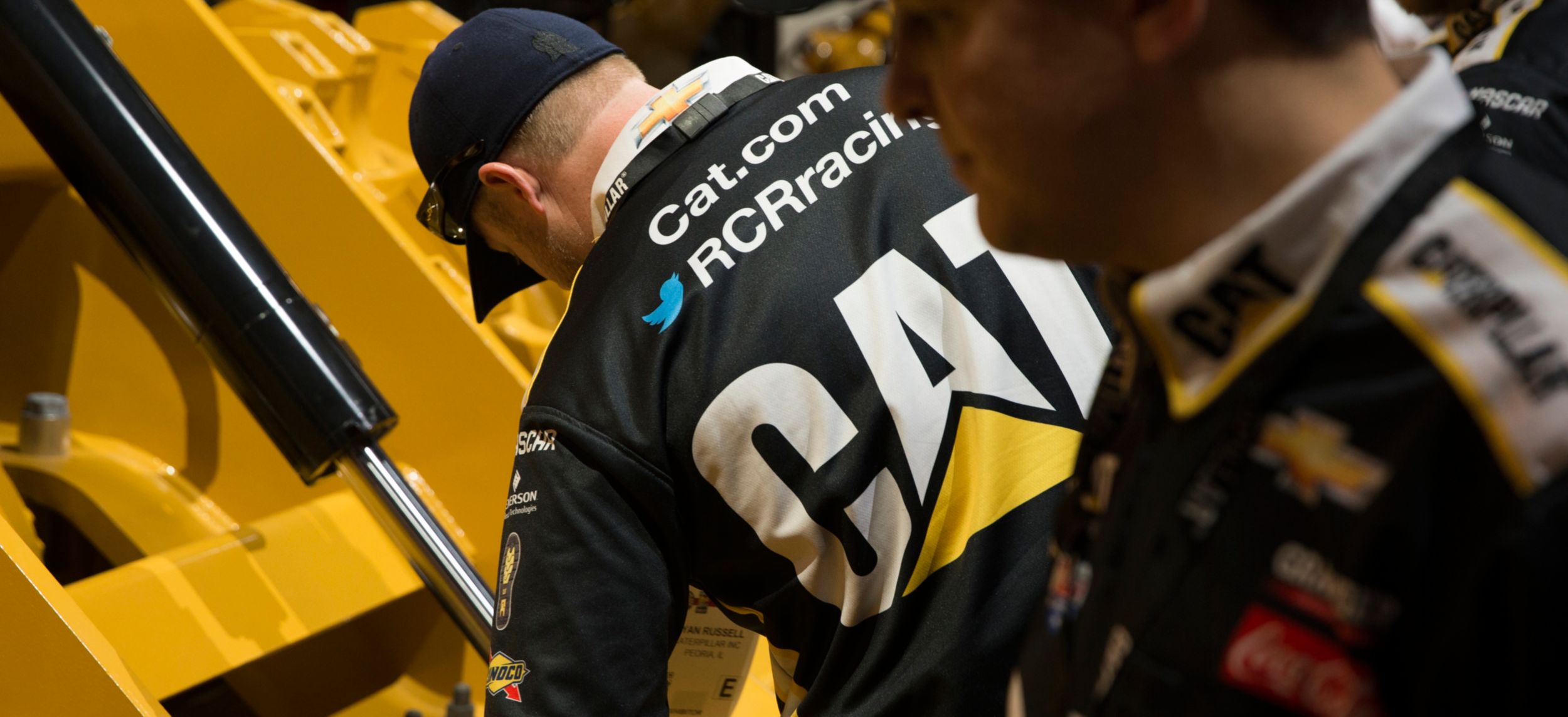 Cat Racing Taking a Lap in Victory Lane Motorgrader technology cat equipment