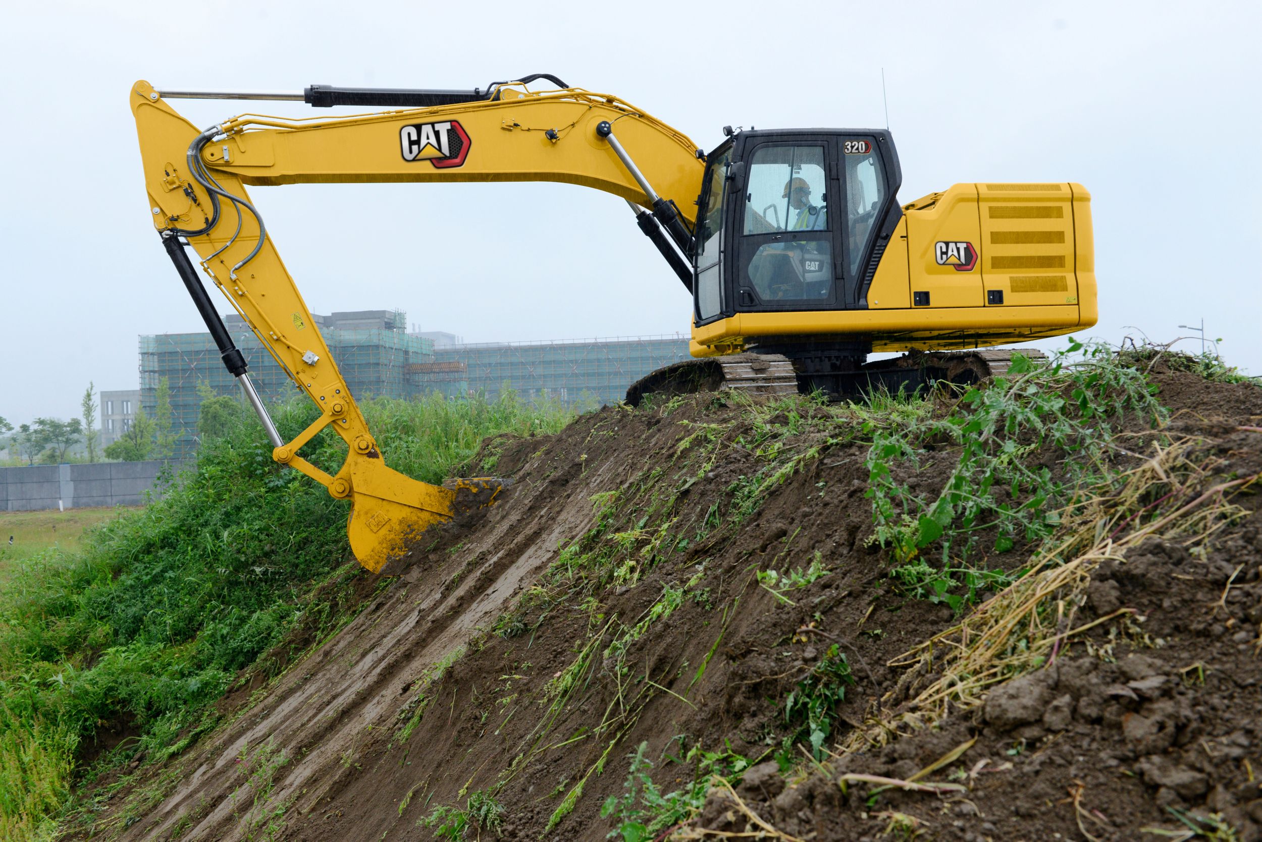 320 Excavator Digging on Hillside