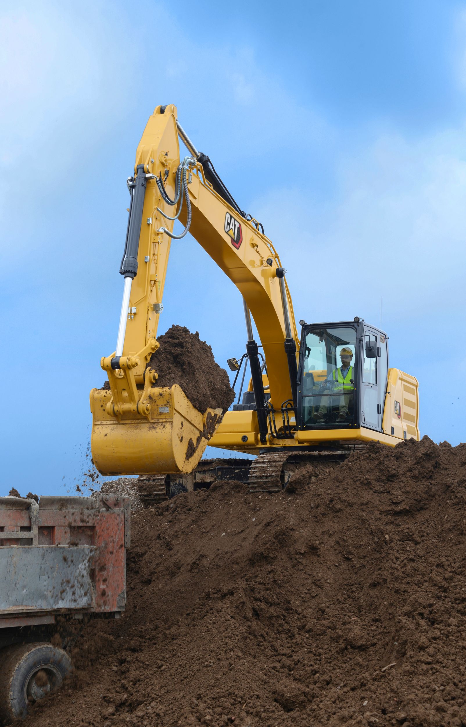 320 Excavator Filling a Dump Truck