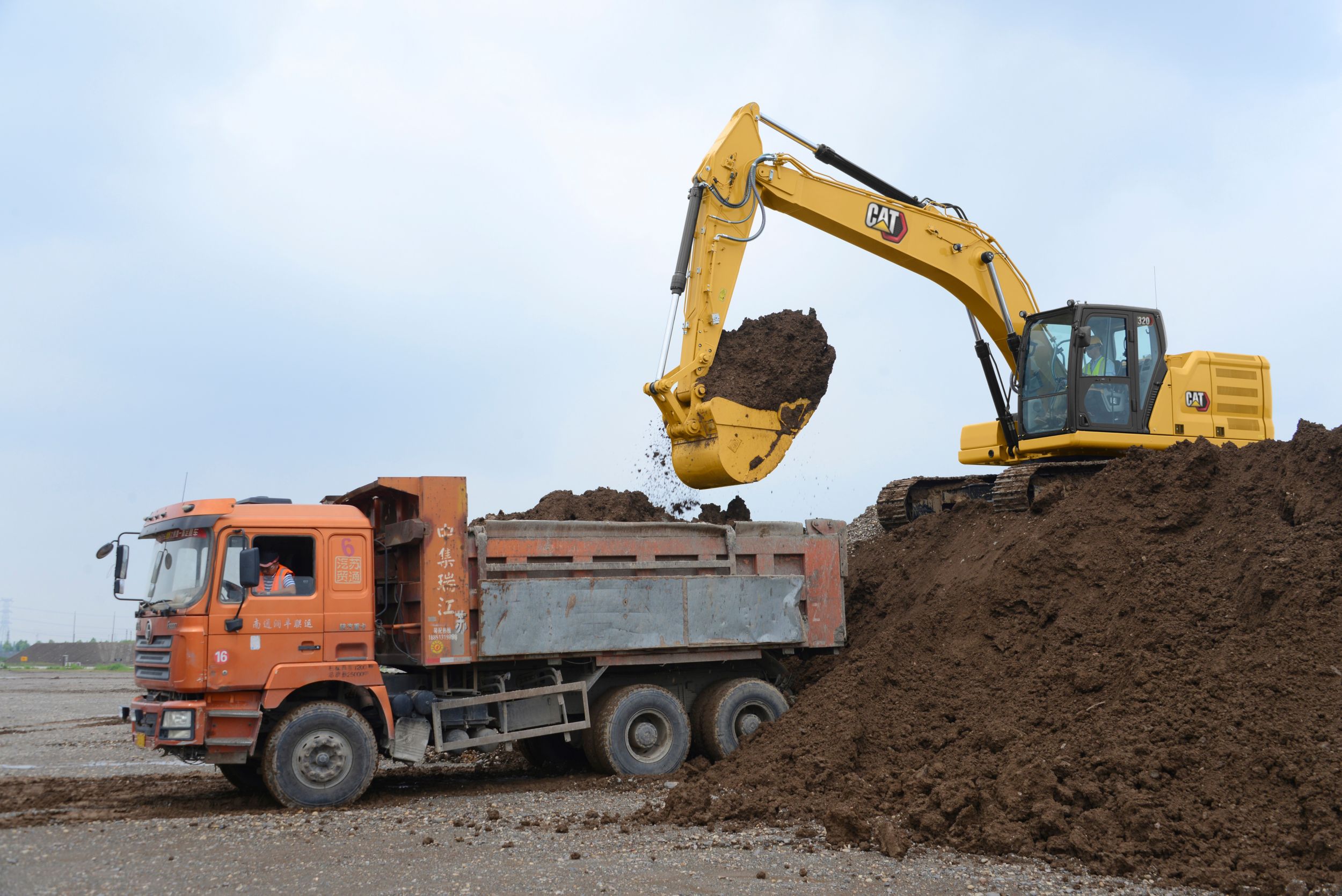 320 Excavator Loading a Truck