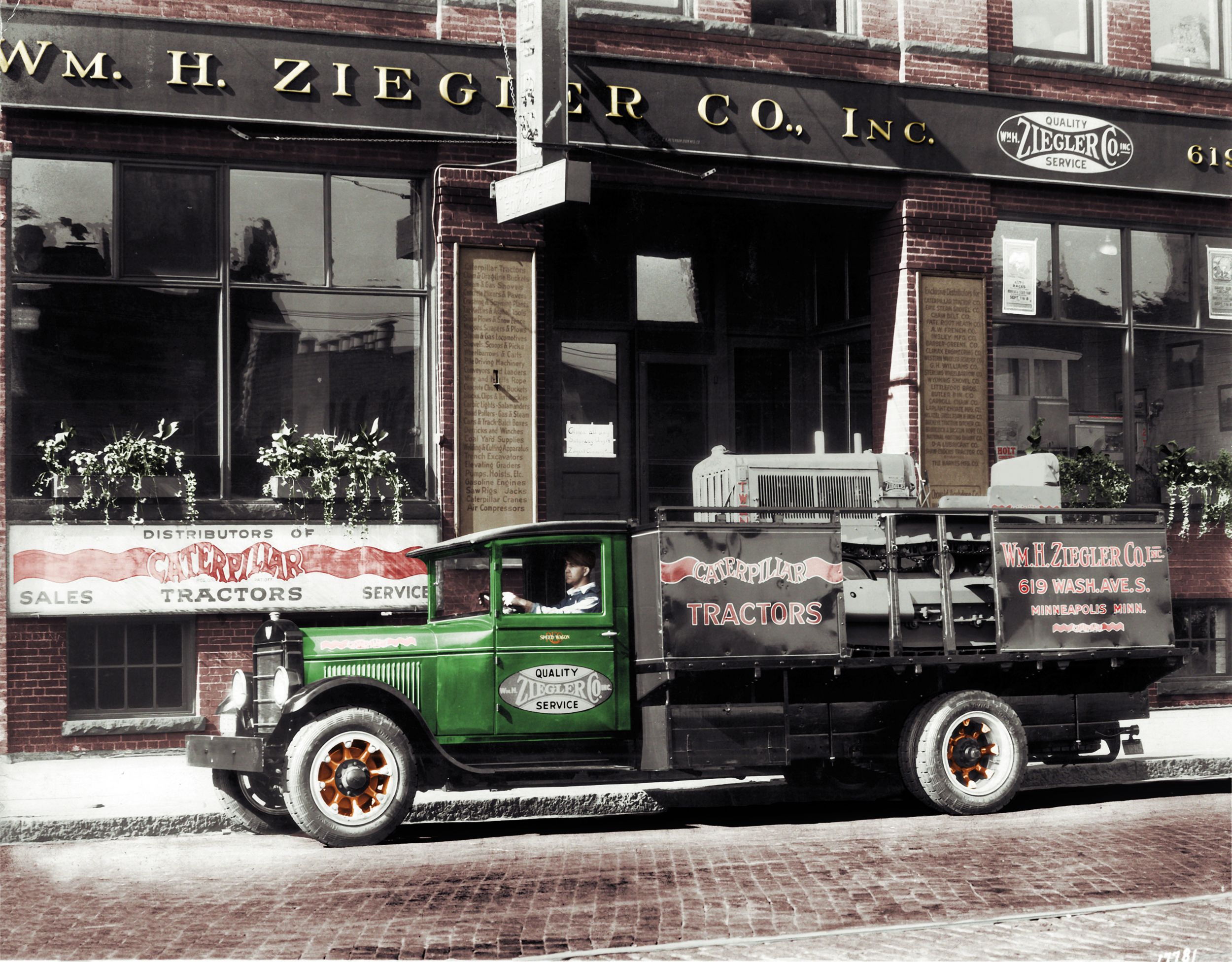 Dealer services truck outside building
