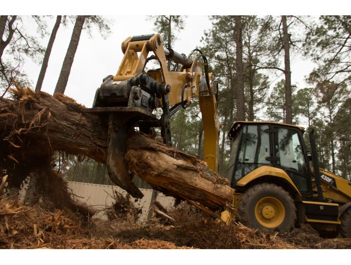 Cat® 420F2 Backhoe Loader with Thumb and Ripper in Working Application