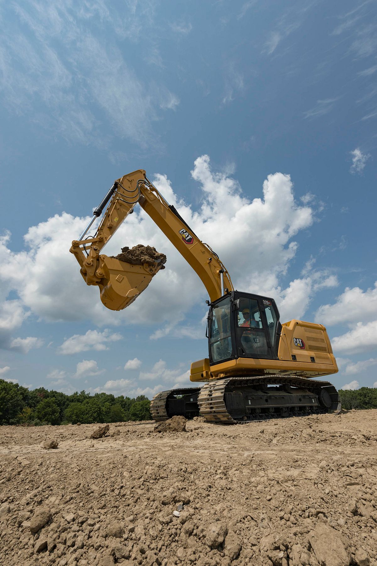 320 GC Excavator with a full bucket