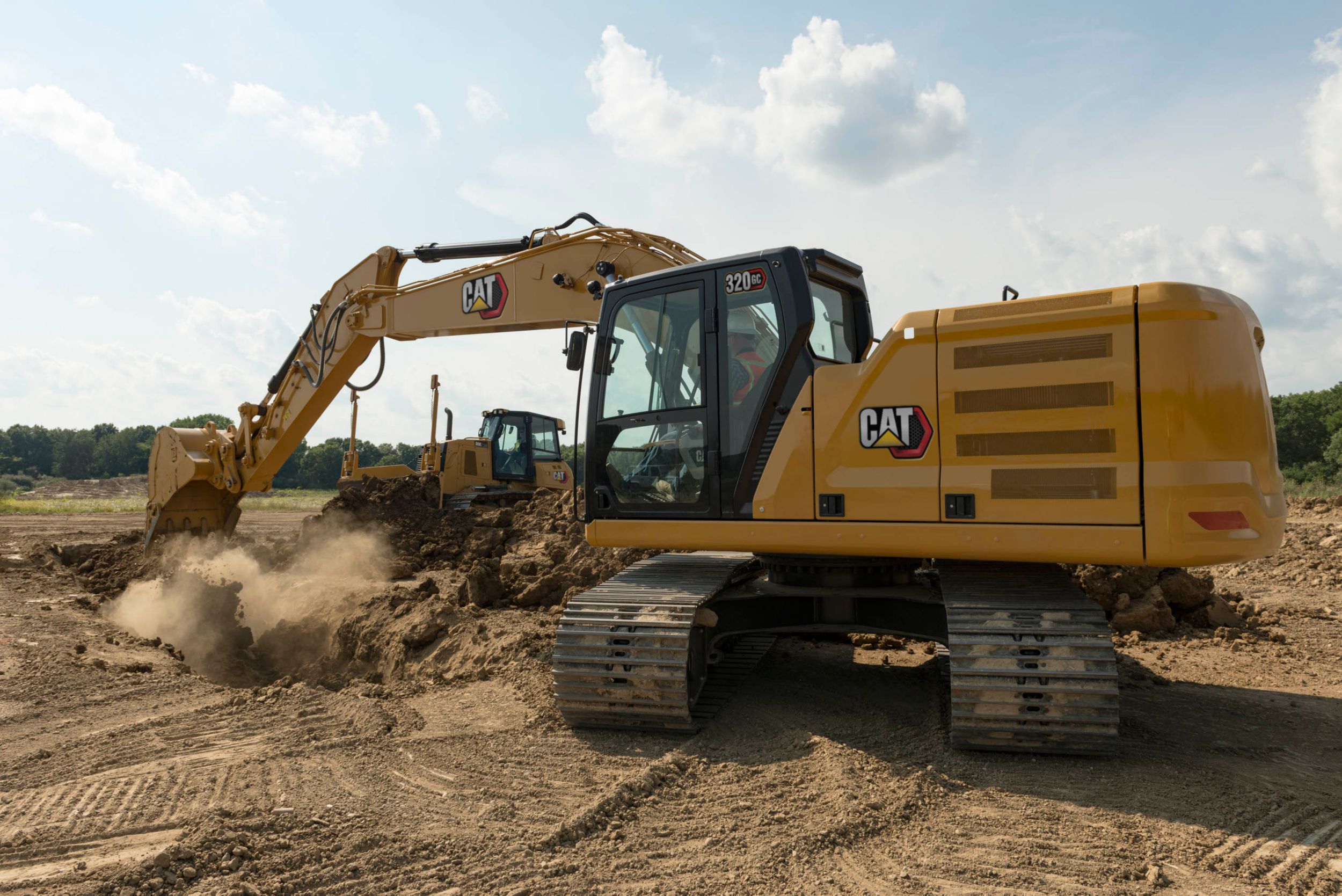 320 GC track Excavator digging a trench