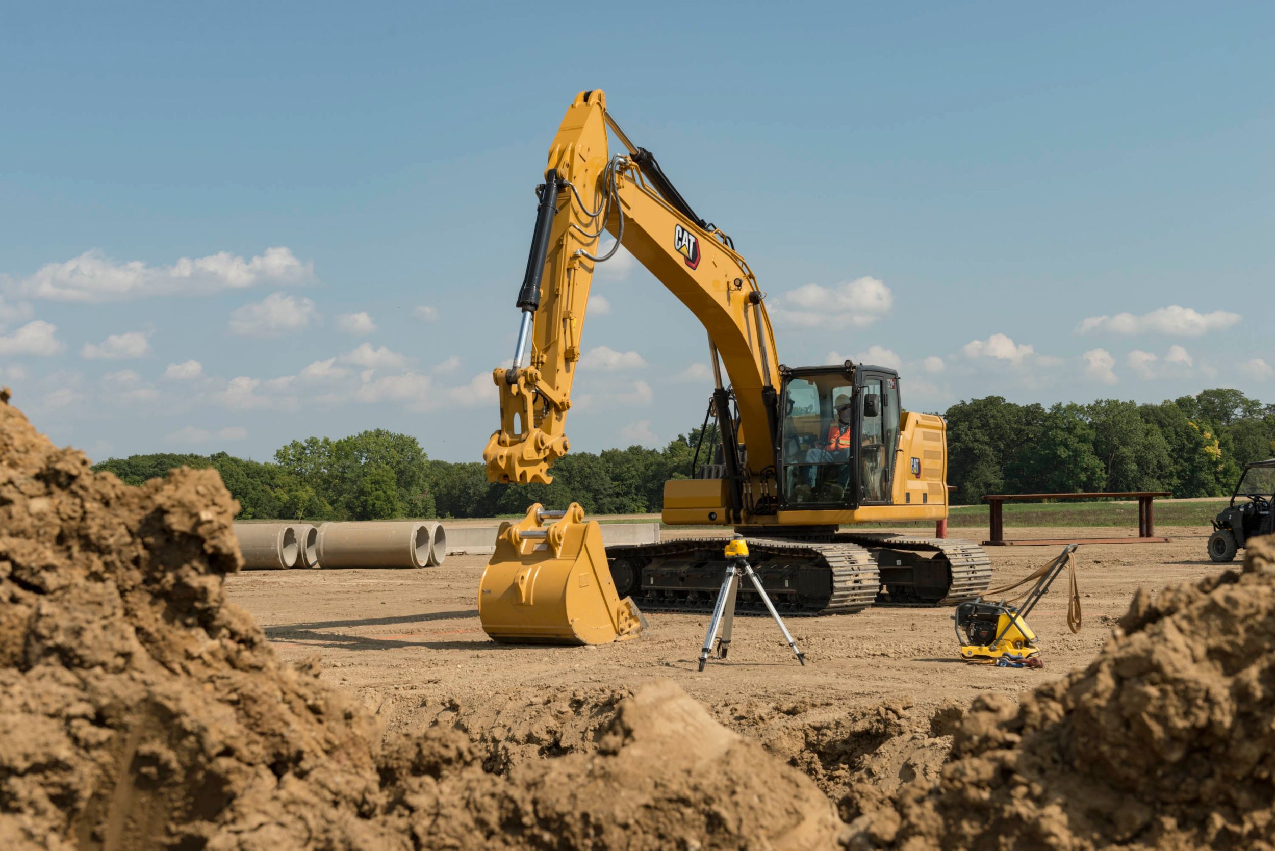 320 GC Excavator switching to a bucket attachment