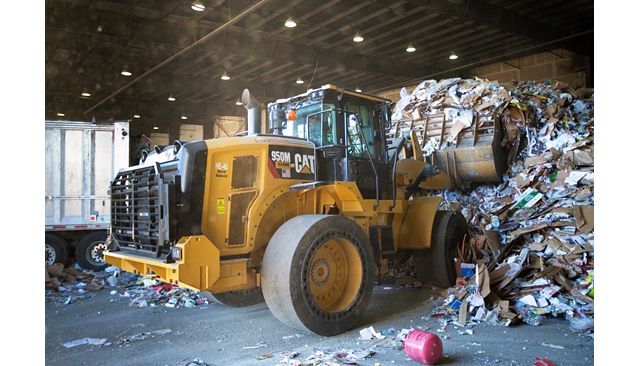 950M Waste Handler working hard in a recycling depot