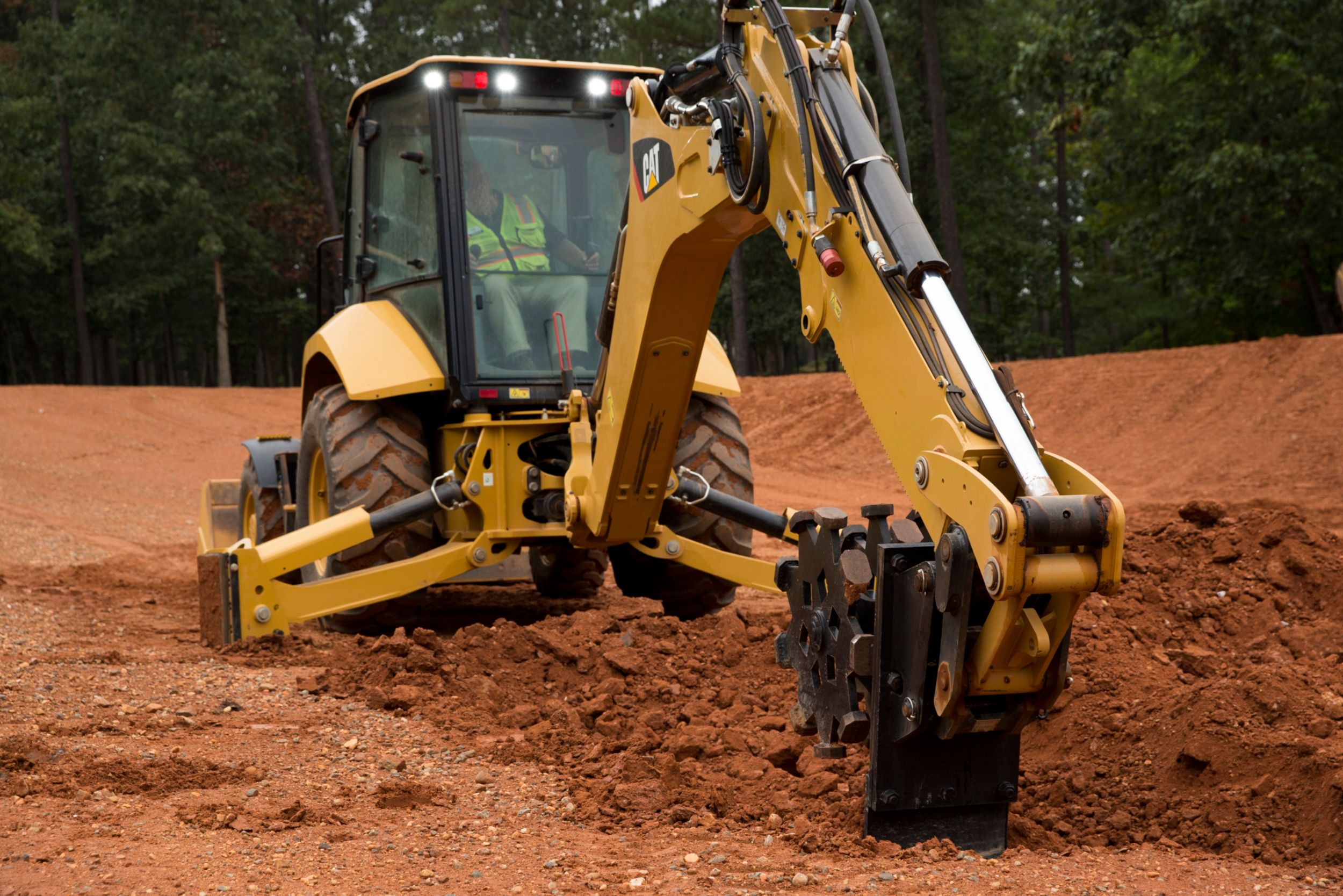 Using backfill plate on Cat® Compaction Wheel to smooth trench bottom