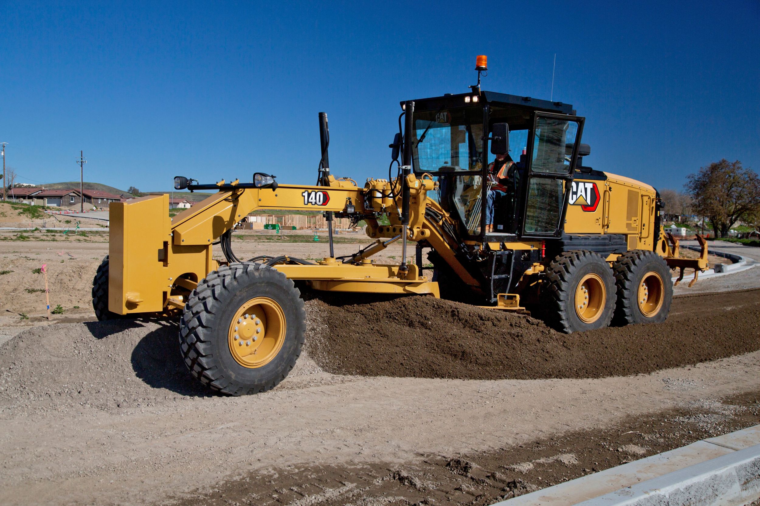 140 Motor Grader mixing materials