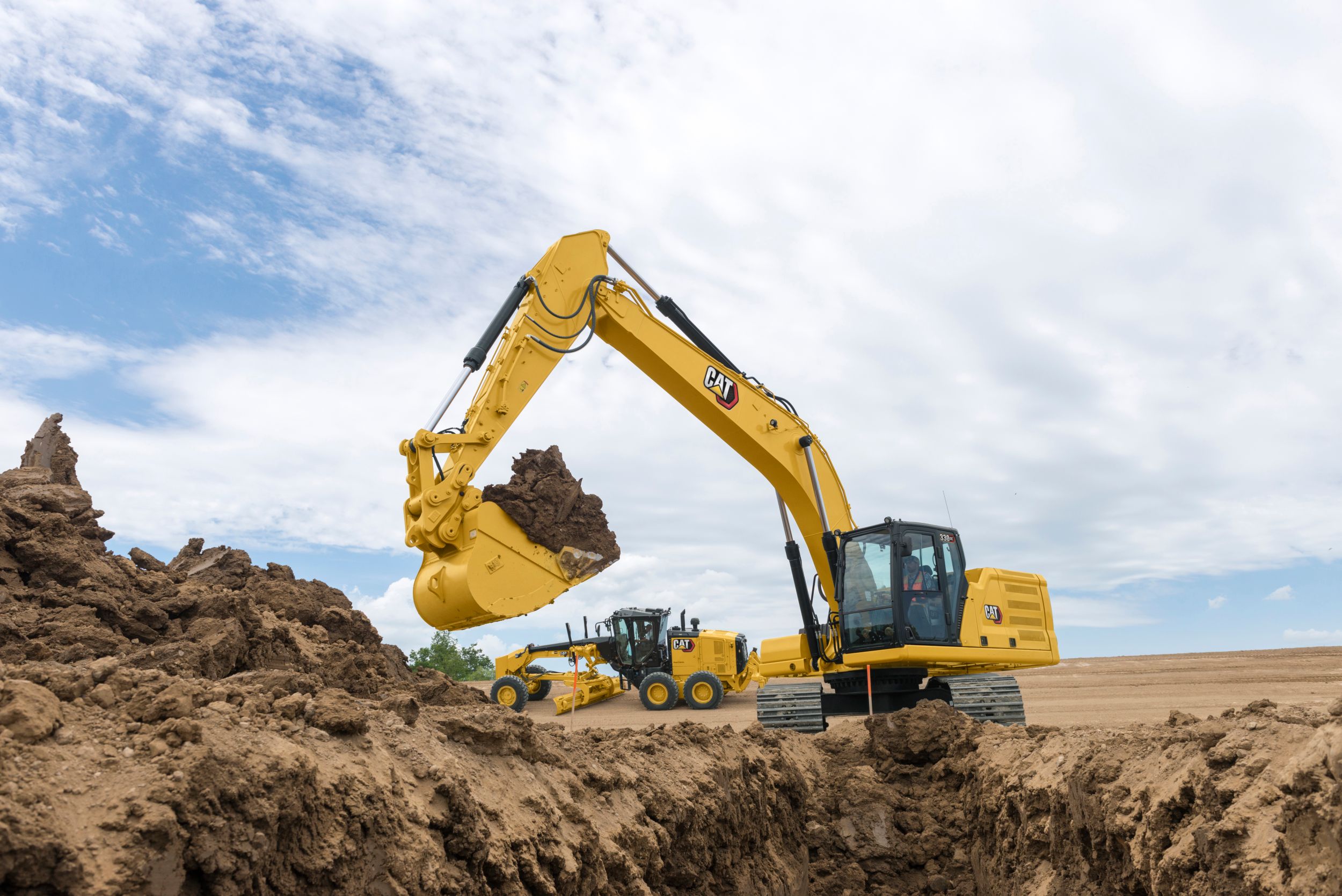 330 GC Hydraulic Excavator with a full bucket of dirt