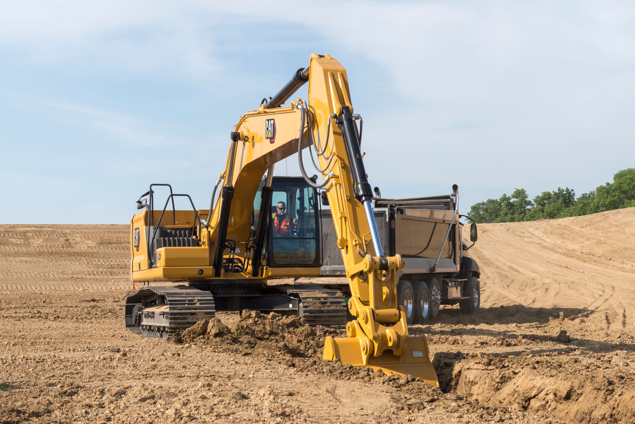 330 GC Hydraulic Excavator digging a utility trench