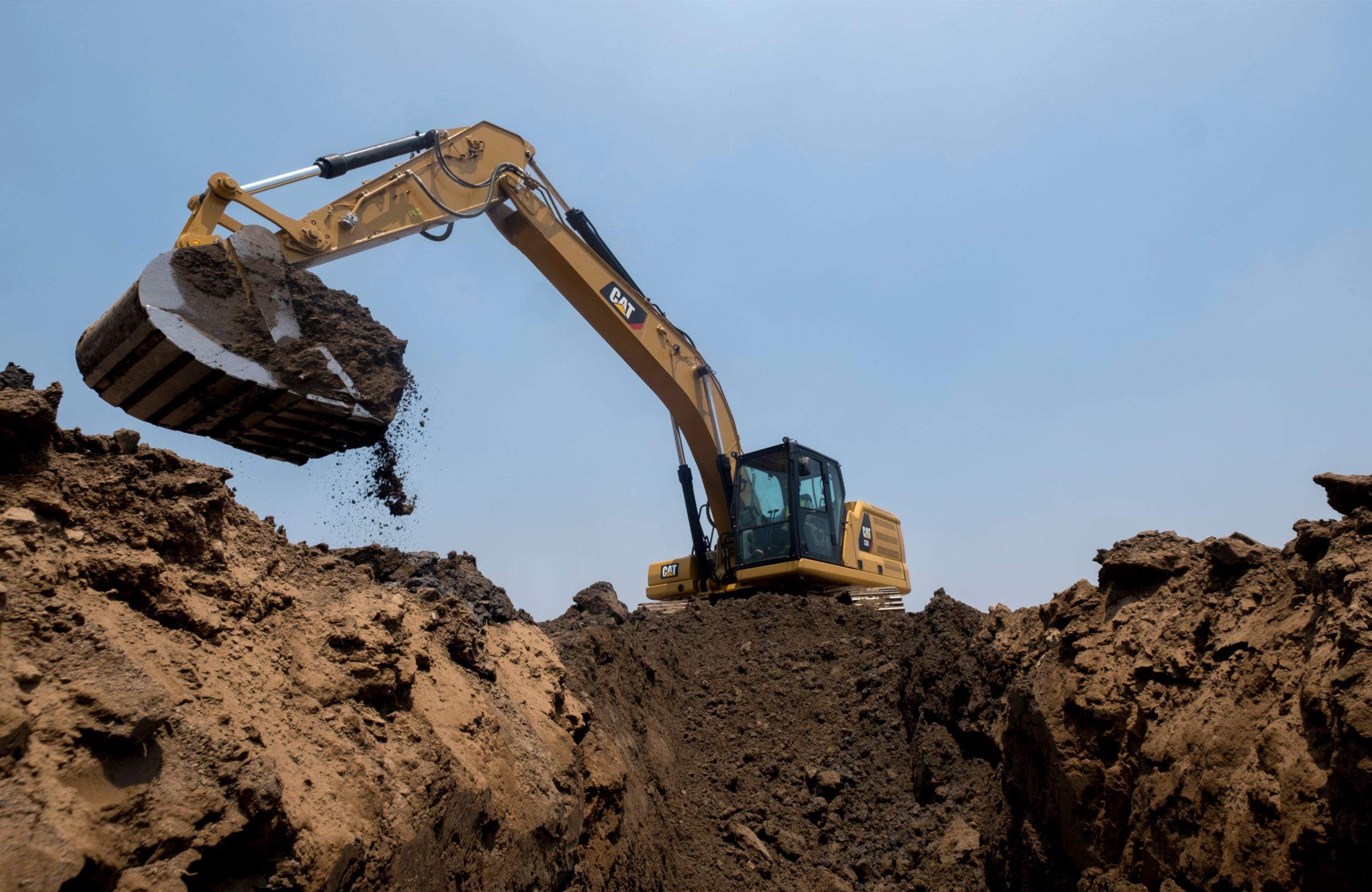 330 Excavator Digging a Trench