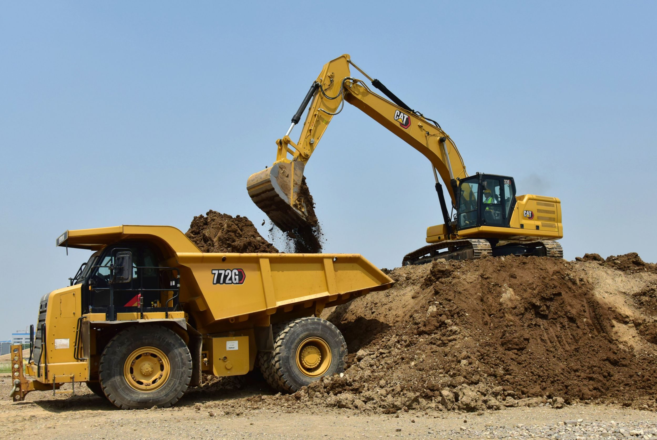 330 Excavator Filling a Dump Truck