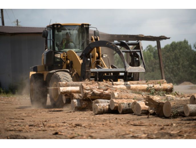 Semi Millyard Forks loading loose logs.