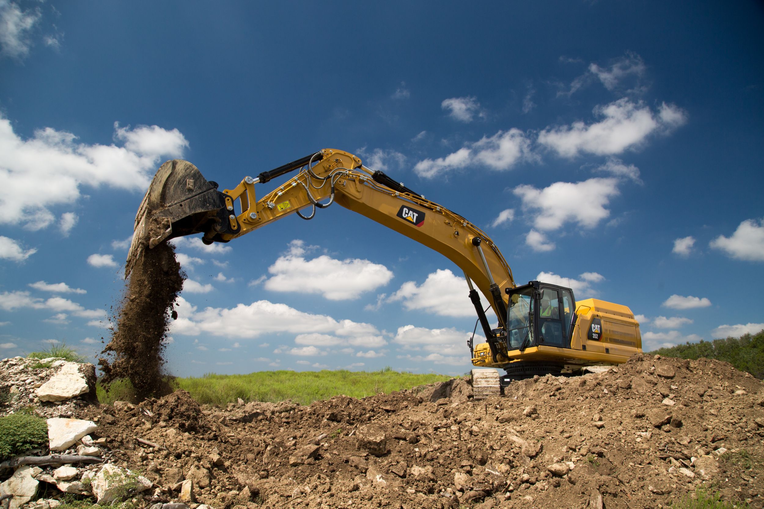Cat® 352 hydraulic trackhoe excavators bring premium power, performance, control, digging, trenching, and heavy lifting capacity to your large scale projects.